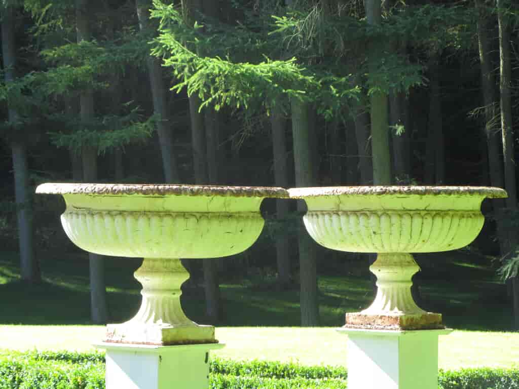 cast-iron-tazzas-pictured-in-a-woodland-garden