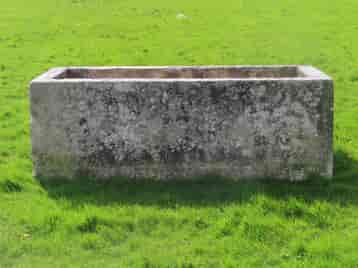 old-stone-water-trough-in-a-garden